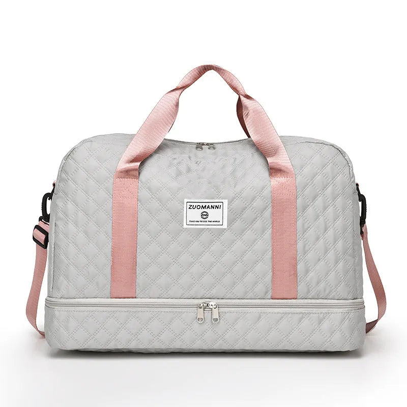 Large Oxford cloth travel bag with 36-55 litre capacity shown in haze blue colour