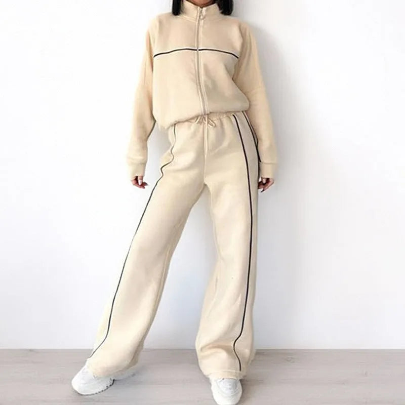 Casual two-piece suit set with a grey hoodie and striped lace-up trousers on a hanger