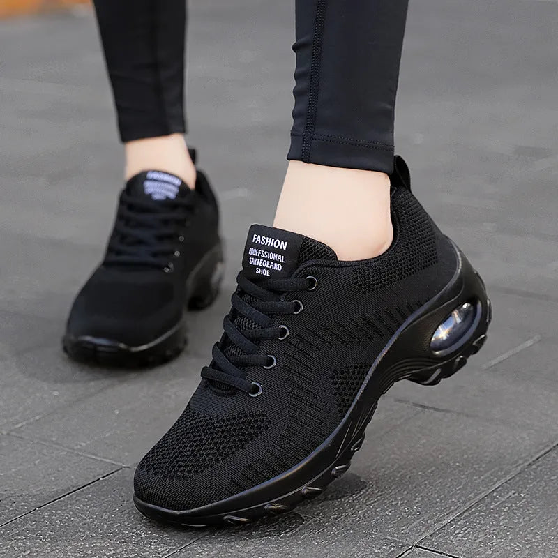 Women's black mesh sneakers with round toe and front lace-up design showing 3-5 cm mid heel