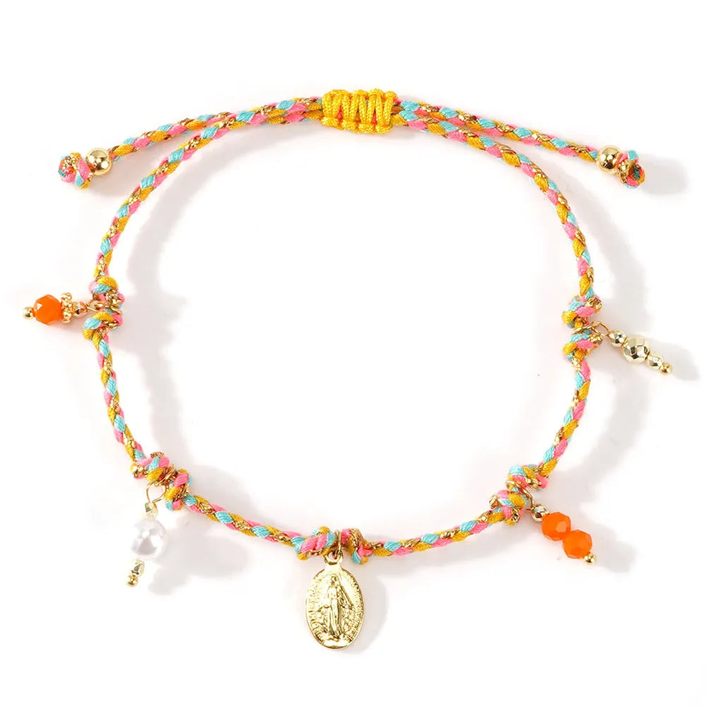 Close-up of a hand-woven colourful braided rope bracelet with an adjustable strap tag closure.