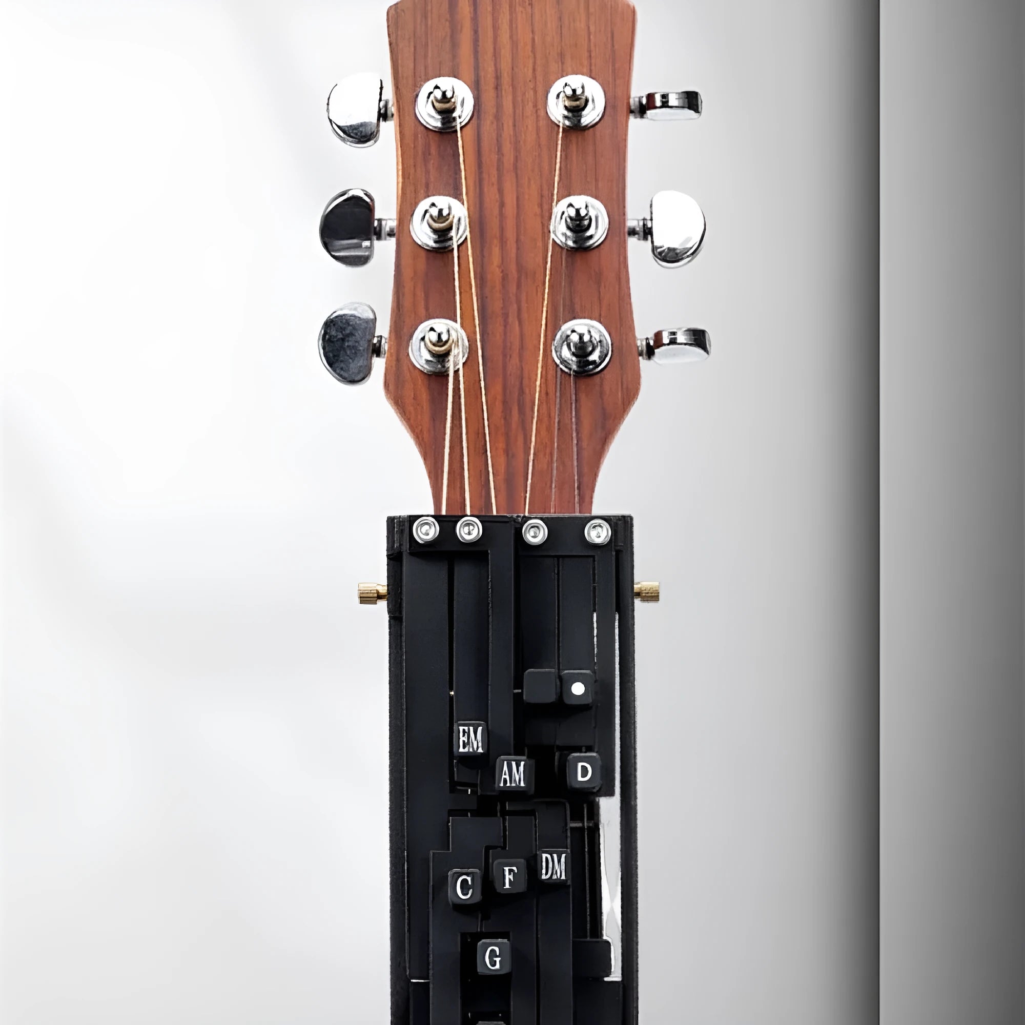 Automatic chord practice device for folk guitar playing and singing