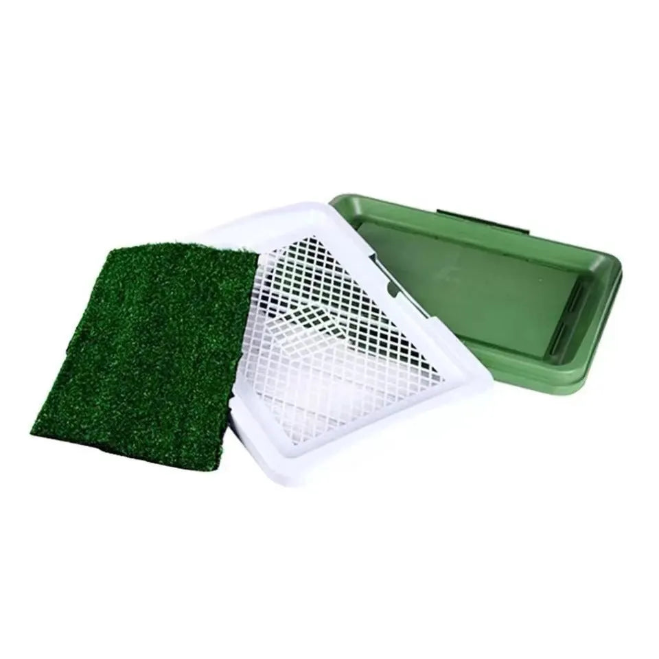 Green artificial grass dog toilet training tray with plastic base and collection basin.