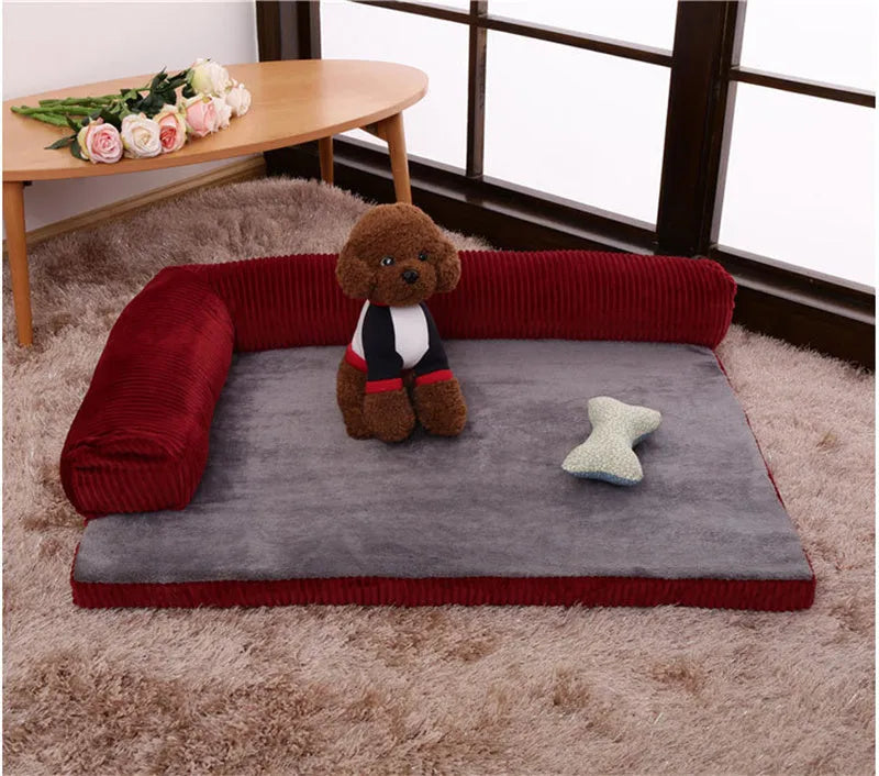 Corduroy dog bed sofa with bolster sides and non-slip base in a neutral colour.