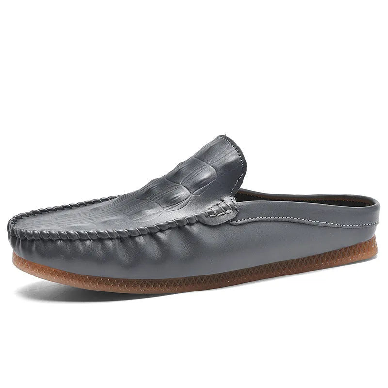 Men's black leisure semi-slipper with Gommino rubber sole and breathable artificial PU upper.
