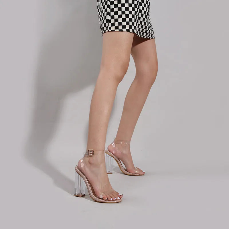 Apricot coloured women's high heel sandals with clear PVC glass heel and silver buckle closure on a round toe.