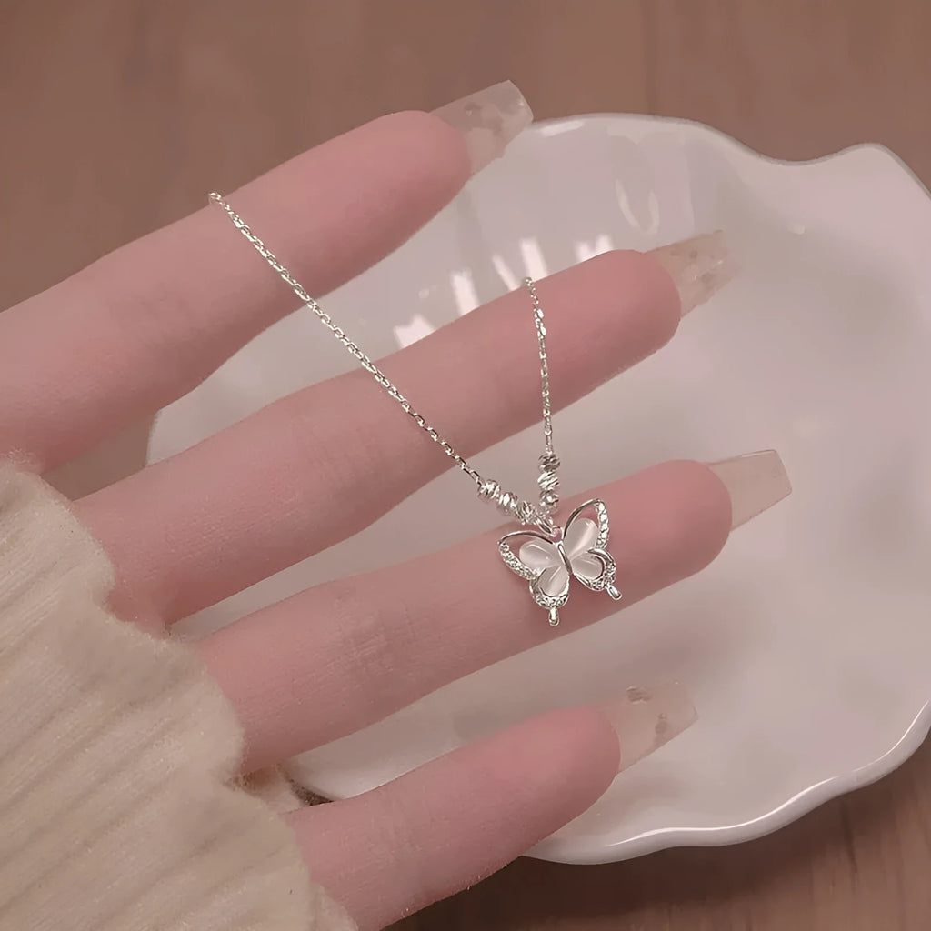 Women's sterling silver butterfly necklace with cross chain design on adjustable 41-50cm perimeter