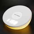 White wireless phone charger with digital clock display showing time, measuring 115mm long
