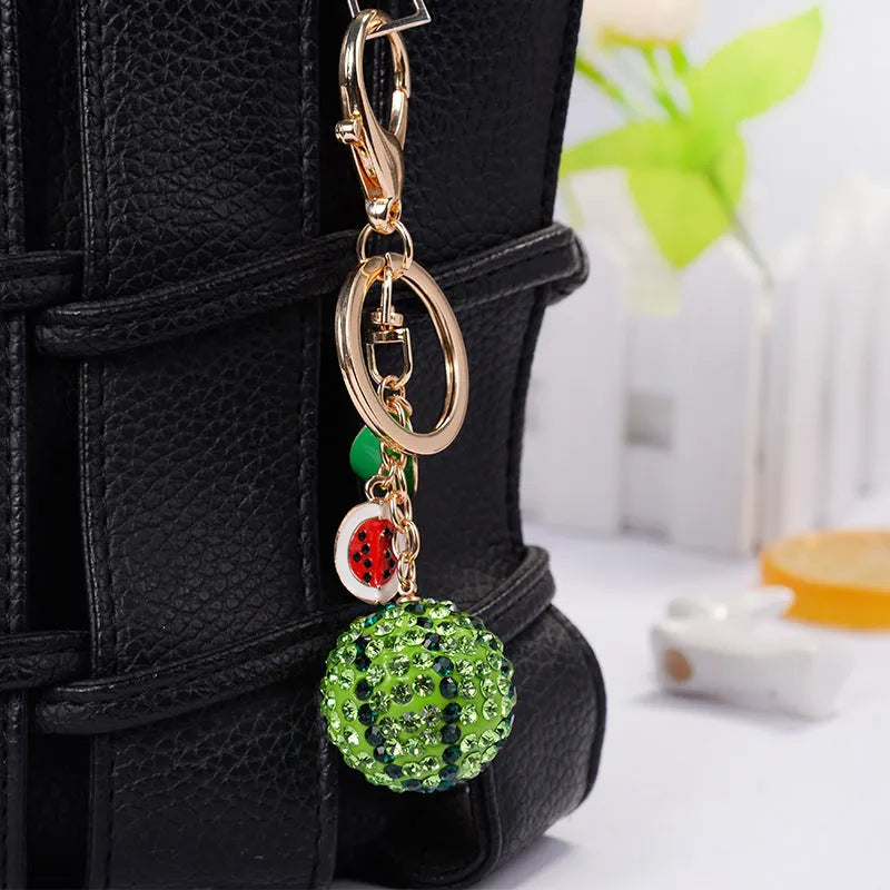 Green watermelon-shaped metal keychain measuring 12cm, made from zinc alloy