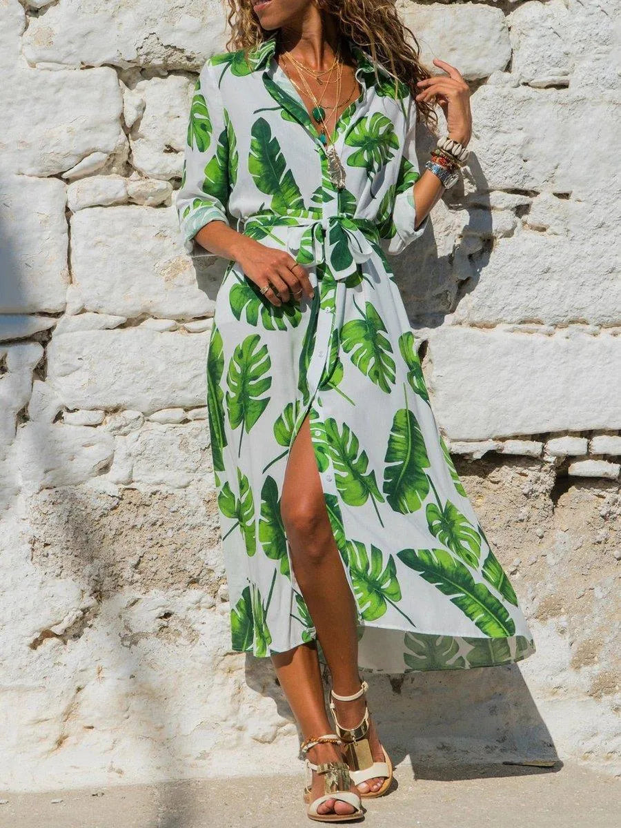 V-neck chiffon dress with high waist and printed pattern, shown in black colour.