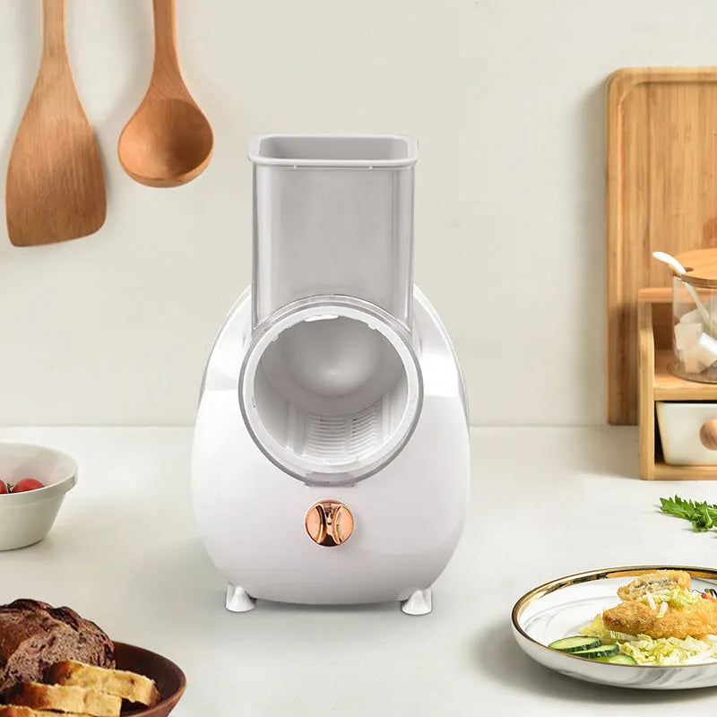 White electric vegetable slicer with rotary grater and multifunctional cutting blades for potatoes and carrots