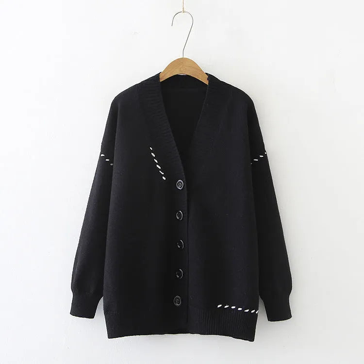 Women's loose fit knitted cardigan coat in black or white with long sleeves