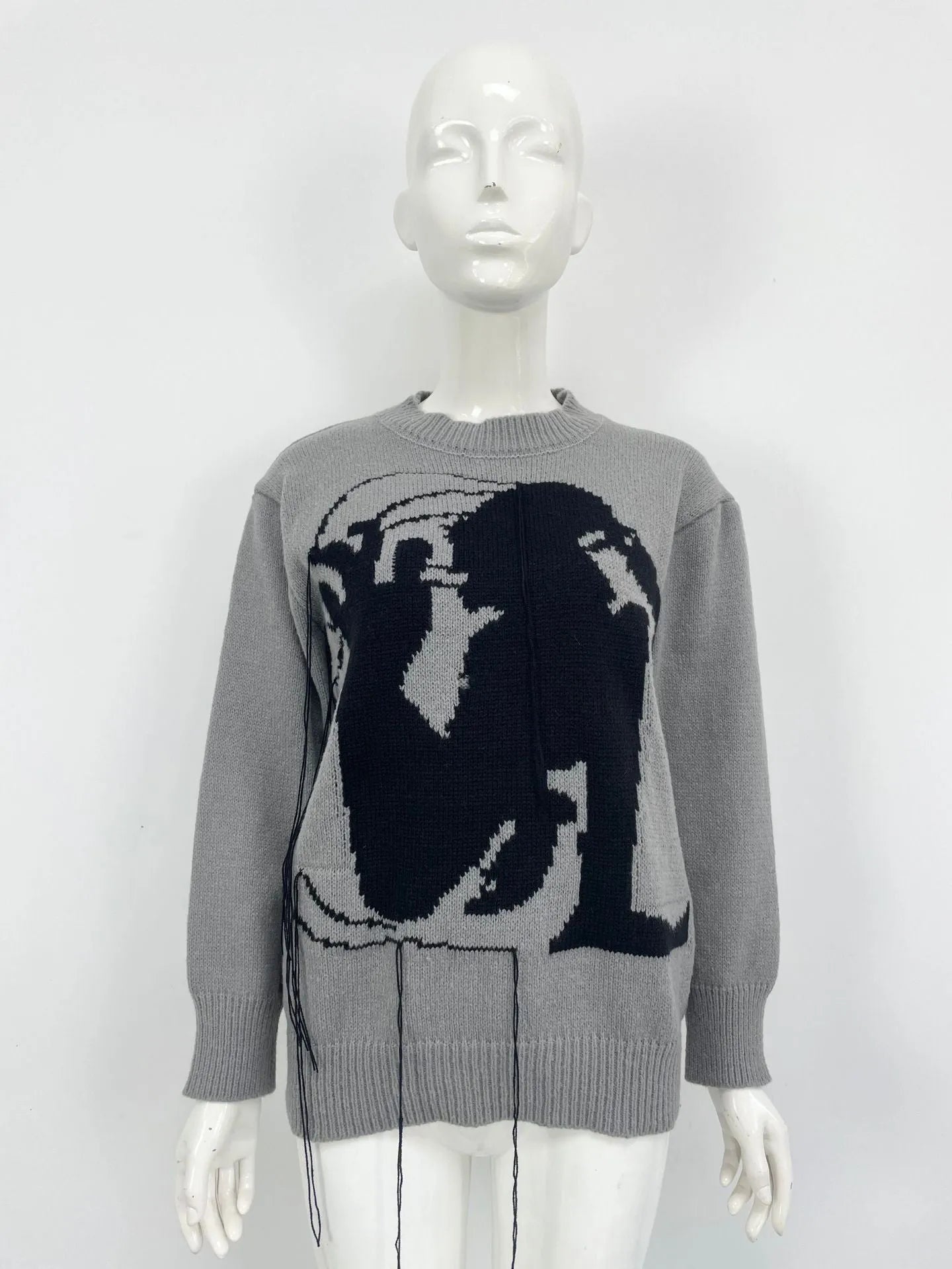 Grey alpaca wool women's sweater with tassel detail and abstract pattern