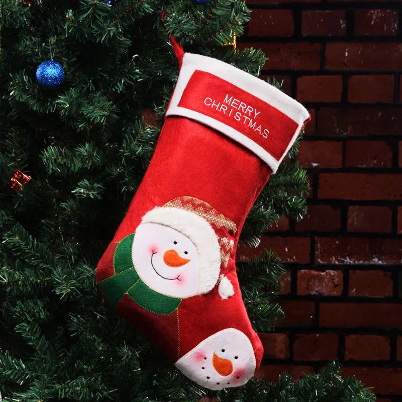 Christmas sock pendant decorations showing elk, Santa, and snowman motifs