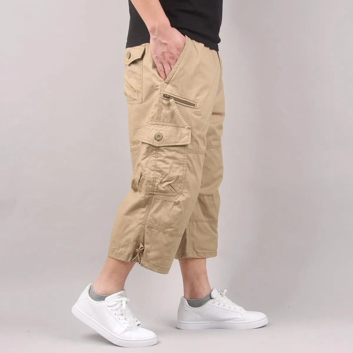 Man wearing loose khaki cotton cropped casual pants for sports.