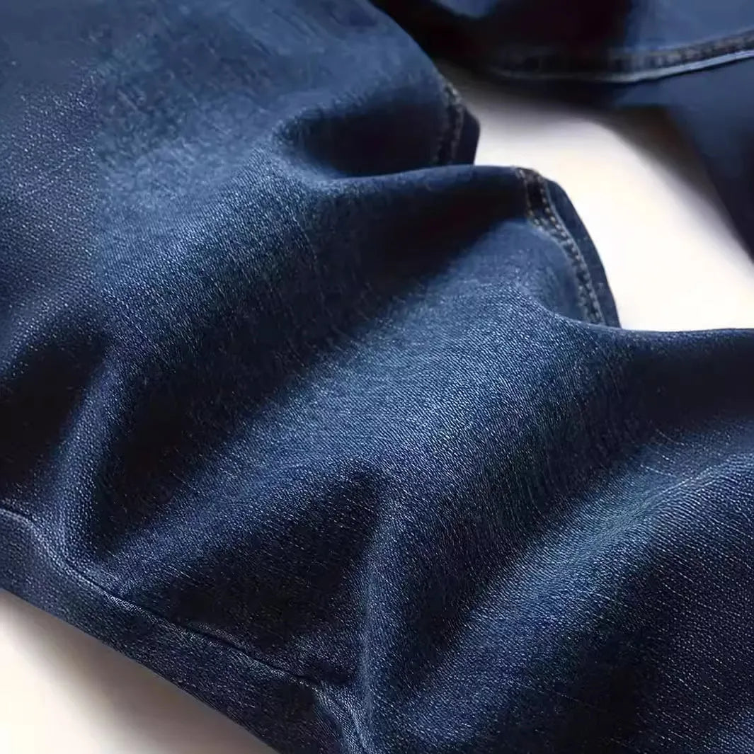 Men's dark blue slim casual jeans with medium elastic waist and skinny leg style