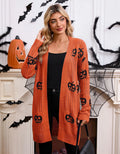 Women's black knitted cardigan with an orange pumpkin head jacquard pattern and regular sleeves.