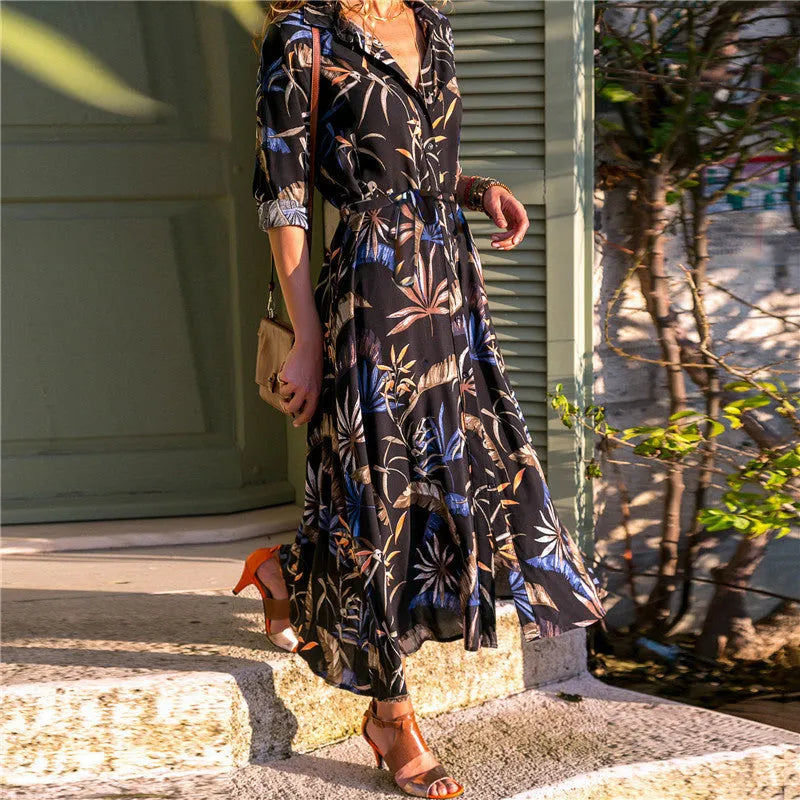 V-neck chiffon dress with high waist and printed pattern, shown in black colour.