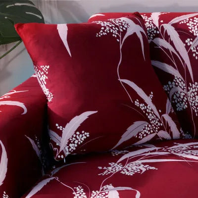 Printed stretch sofa cover with geometric pattern on three-seater sofa