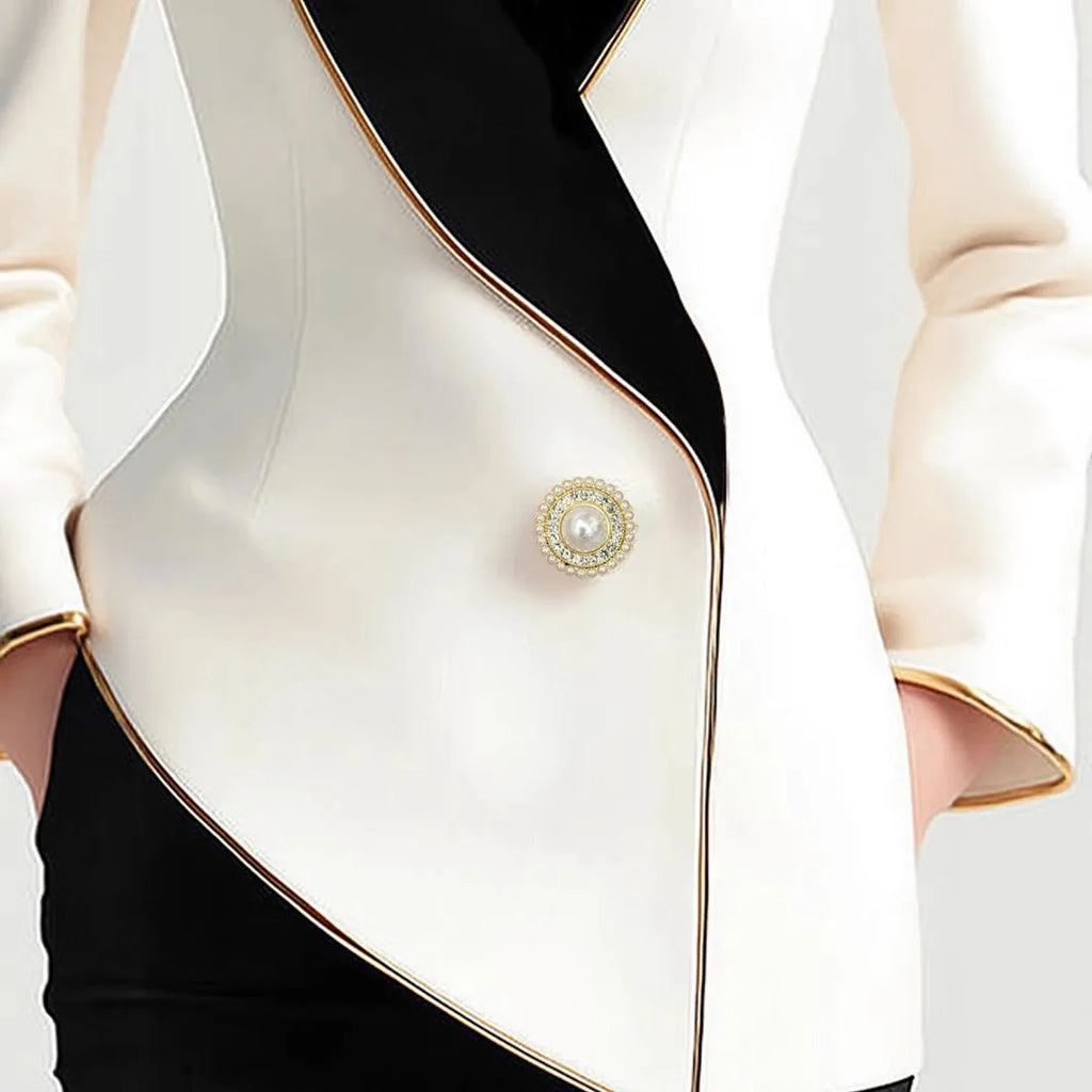 Women's milky white irregular cut coat with gold trim and pearl buttons