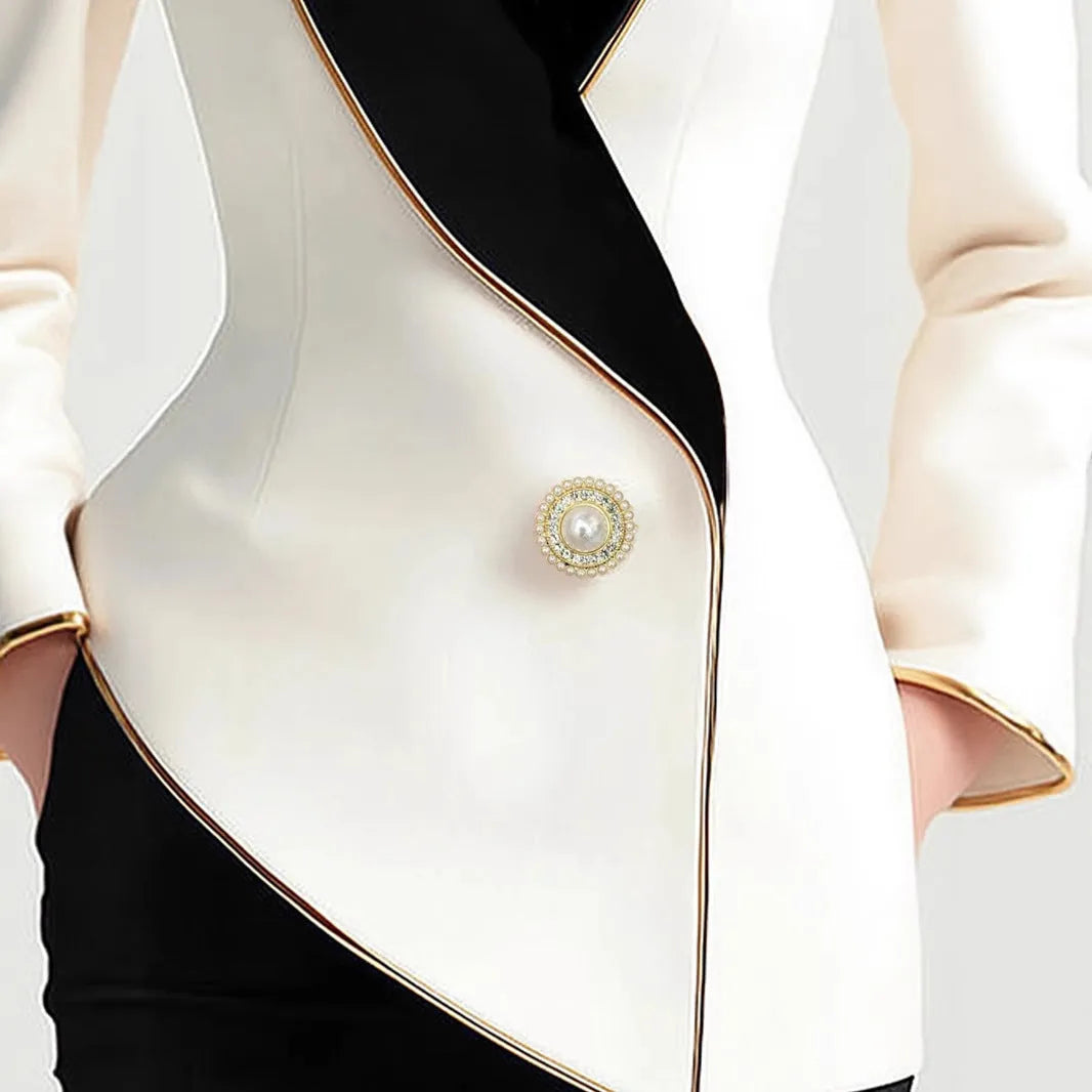 Women's milky white irregular cut coat with gold trim and pearl buttons