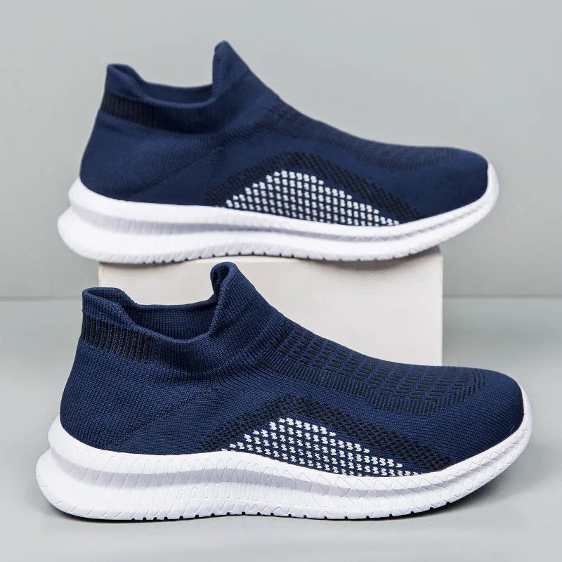 Men's solid colour casual sneakers with fabric upper and low-top design on a white background.