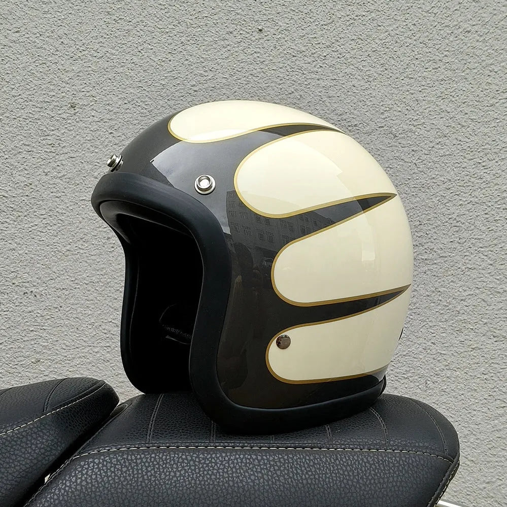 Glass fibre retro half motorcycle helmet shown in multiple colour options including cement grey and matte black flower patterns