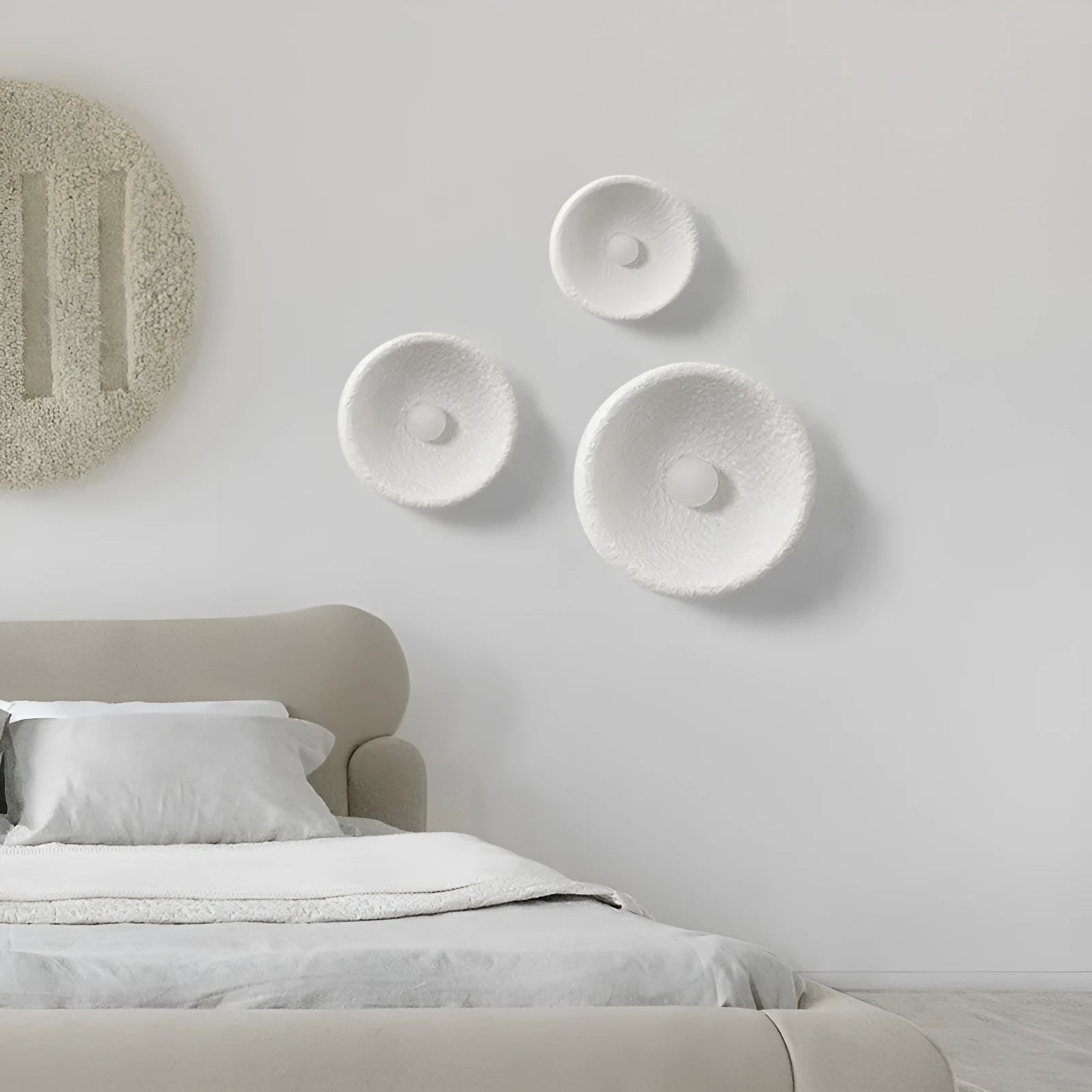Japanese-style minimalist wall lamp with resin shade in three diameter options on modern interior wall