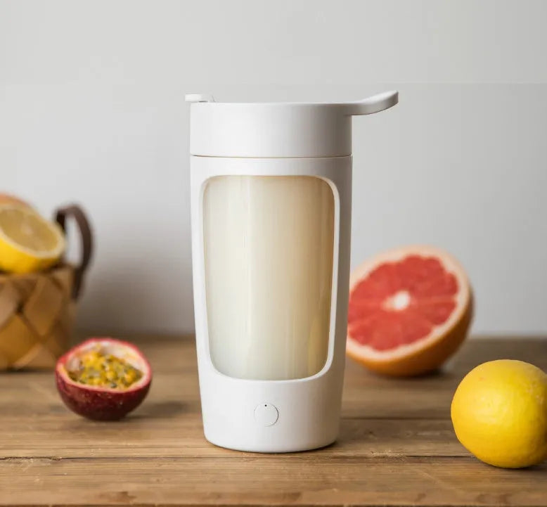 Portable rechargeable blender cup in white, showing cup and motor base, with 650ml capacity mark