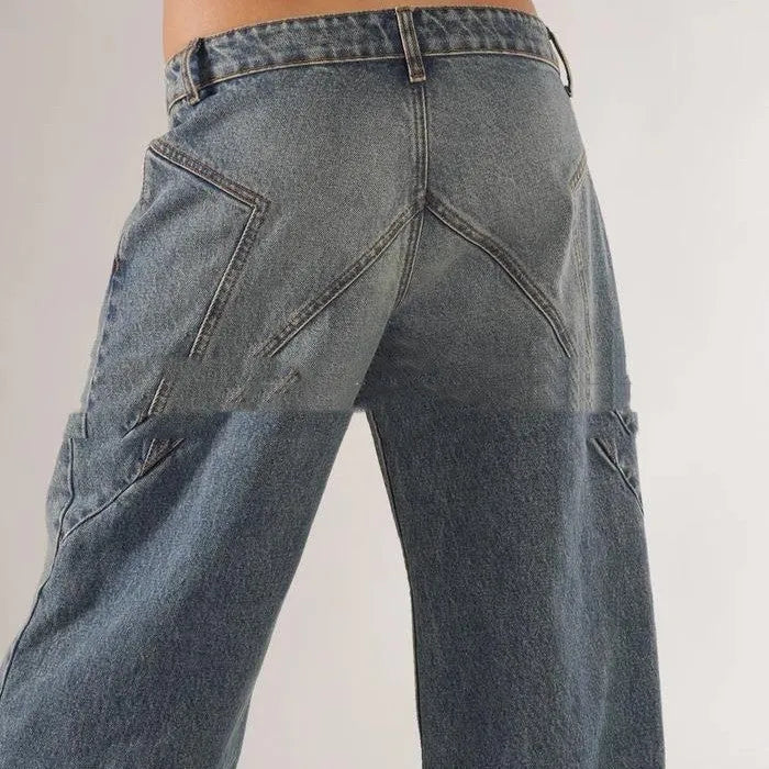 Women's blue cotton wide-leg mop trousers with a loose fit and low waist on a neutral background.