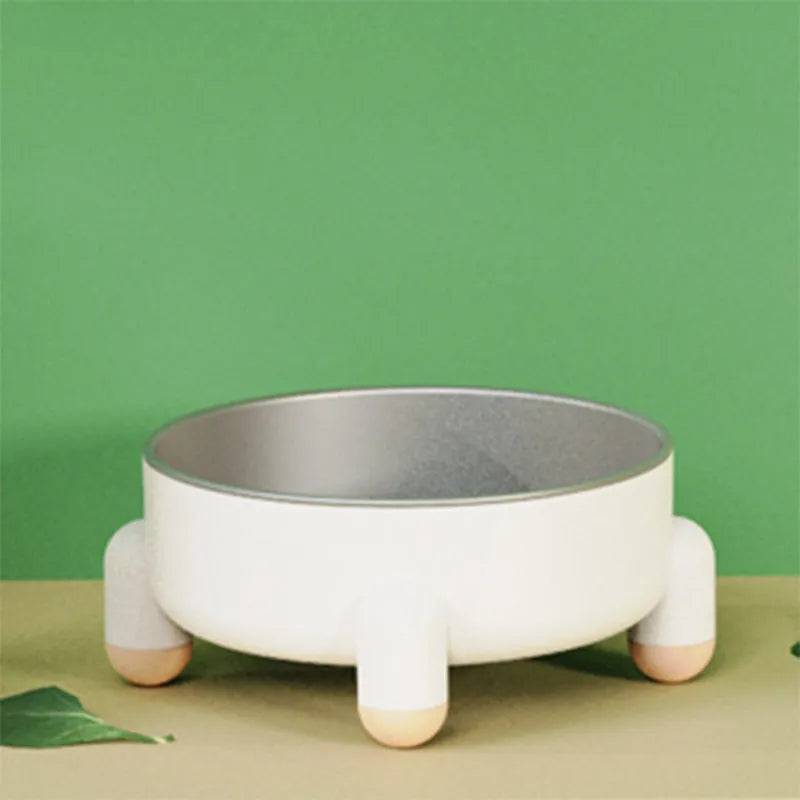 Green stainless steel pet bowl with a non-slip base and raised high foot for dogs and cats.