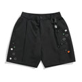 Black semi-elastic shorts with colour button fastening and straight leg loose fit design
