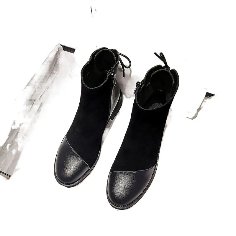 Black women's over-the-knee Martin boots with side zipper and decorative bow.
