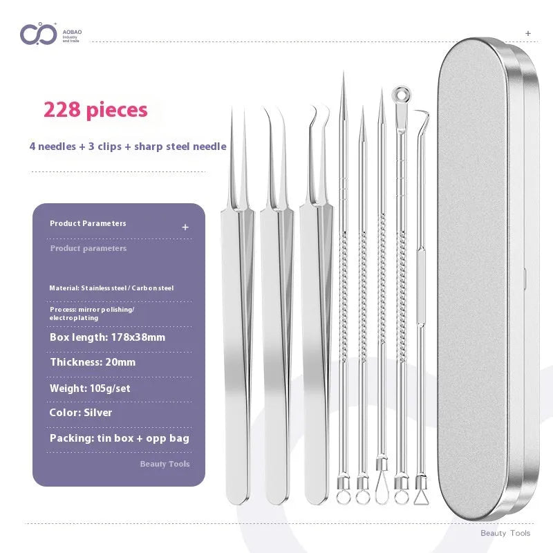 Four silver metal acne needles with pointed tips laid out on a flat surface.