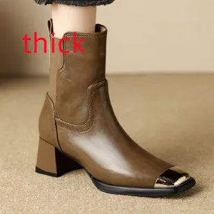Women's brown cowhide leather Martin boots with a high heel and side zipper on a white background.