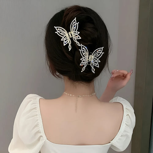 Butterfly-shaped alloy hair clip barrette for women, shown in rhinestone and pearl style options.