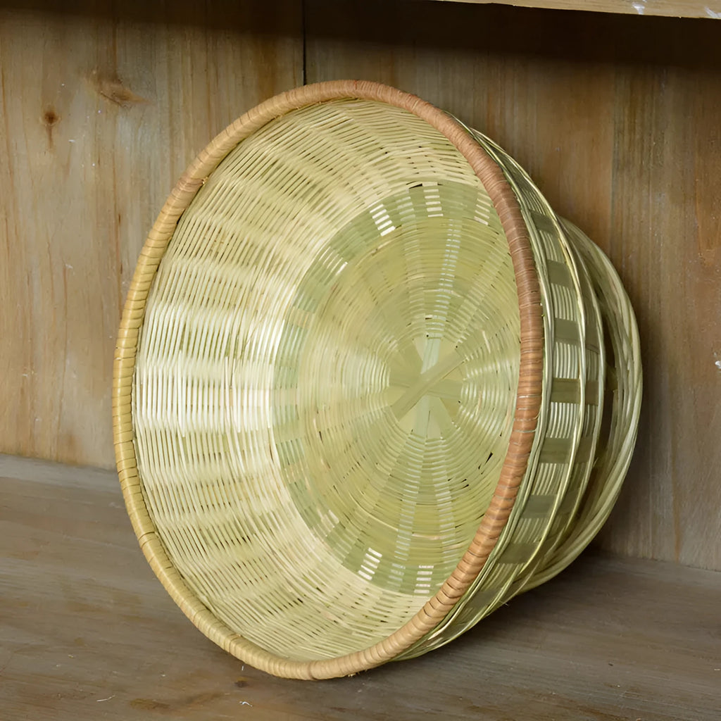 Handmade natural bamboo storage basket shown in one of three size options for household organisation.