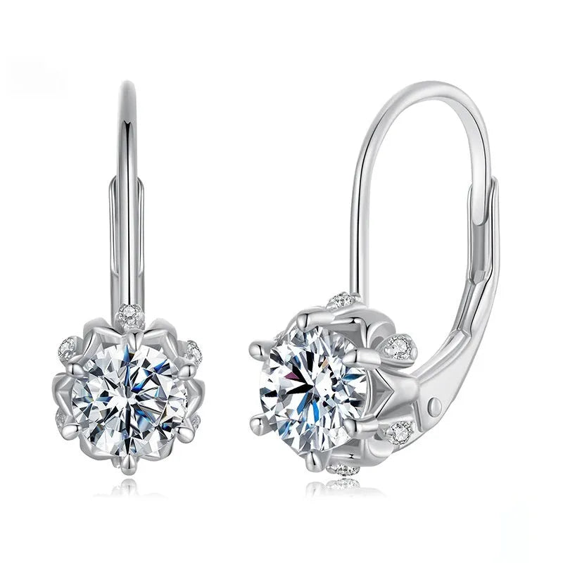 Close-up of a sterling silver flower bud clip earring with a moissanite centre, shown on a white background.