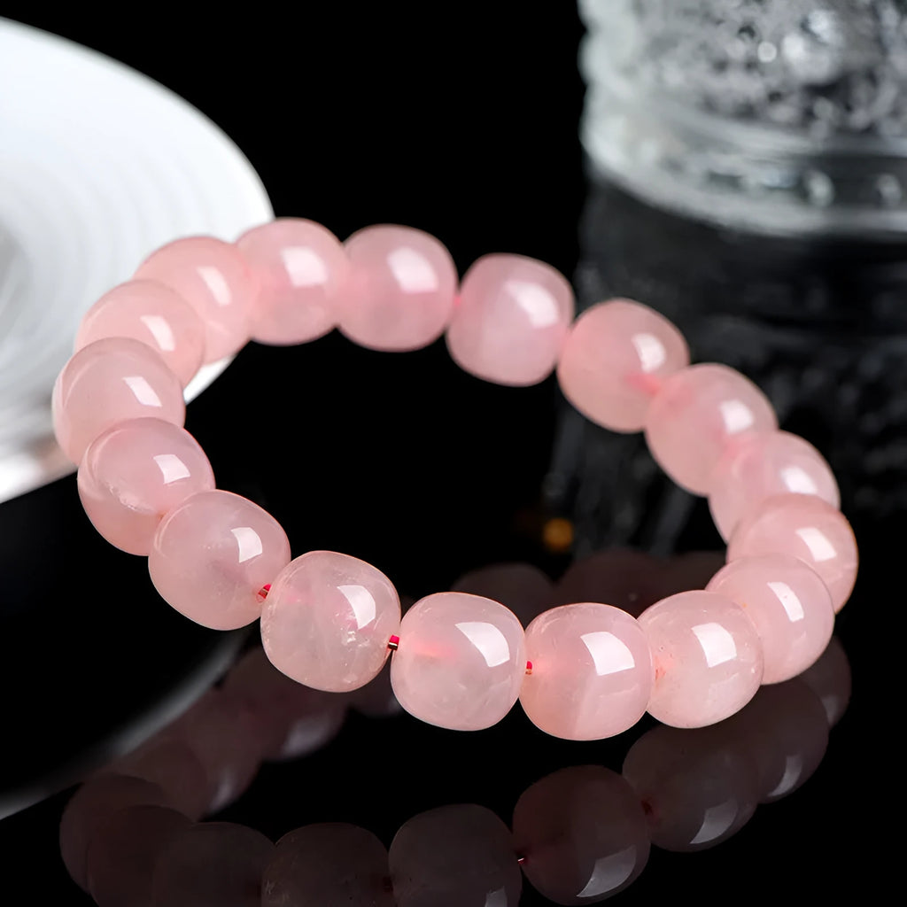 Pink crystal barrel bead bracelet with geometry design and polished finish