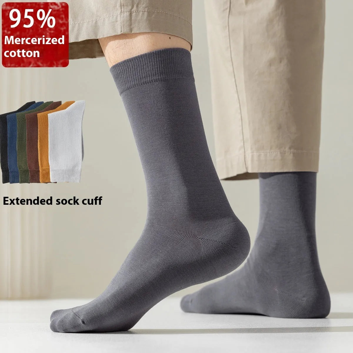 Men's solid colour pure cotton mid-calf business socks in beige, black, grey and blue shown folded.