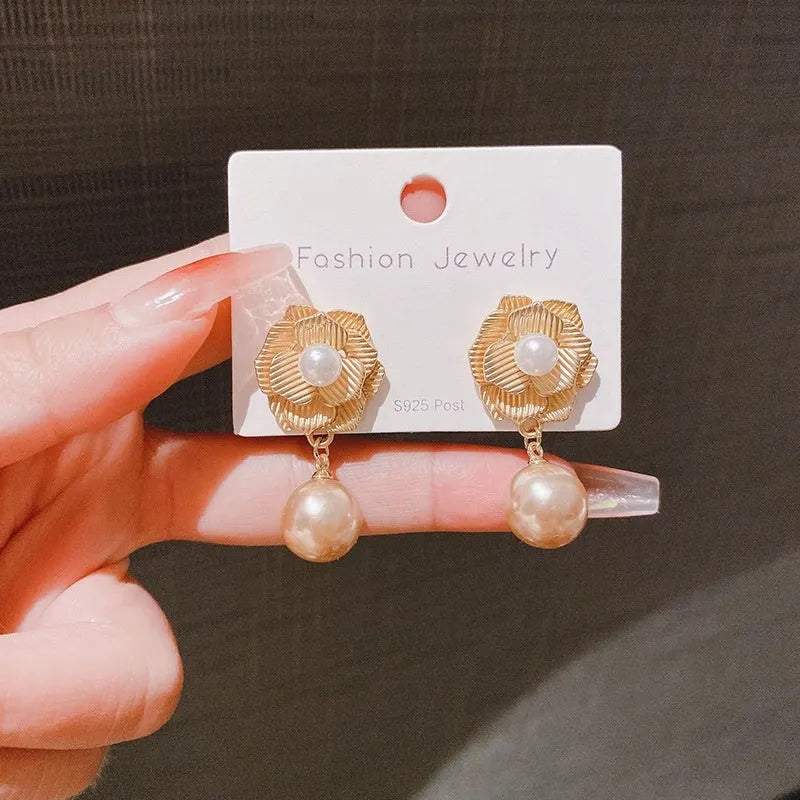 Gold electroplated alloy stud earrings with opal stone and Hong Kong style floral design featuring needle rose pearl and ice flower elements