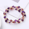 Women's adjustable three-ring crystal bracelet with tourmaline, strawberry quartz, and amethyst beads.