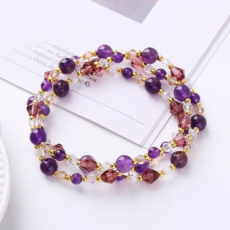 Women's adjustable three-ring crystal bracelet with tourmaline, strawberry quartz, and amethyst beads.