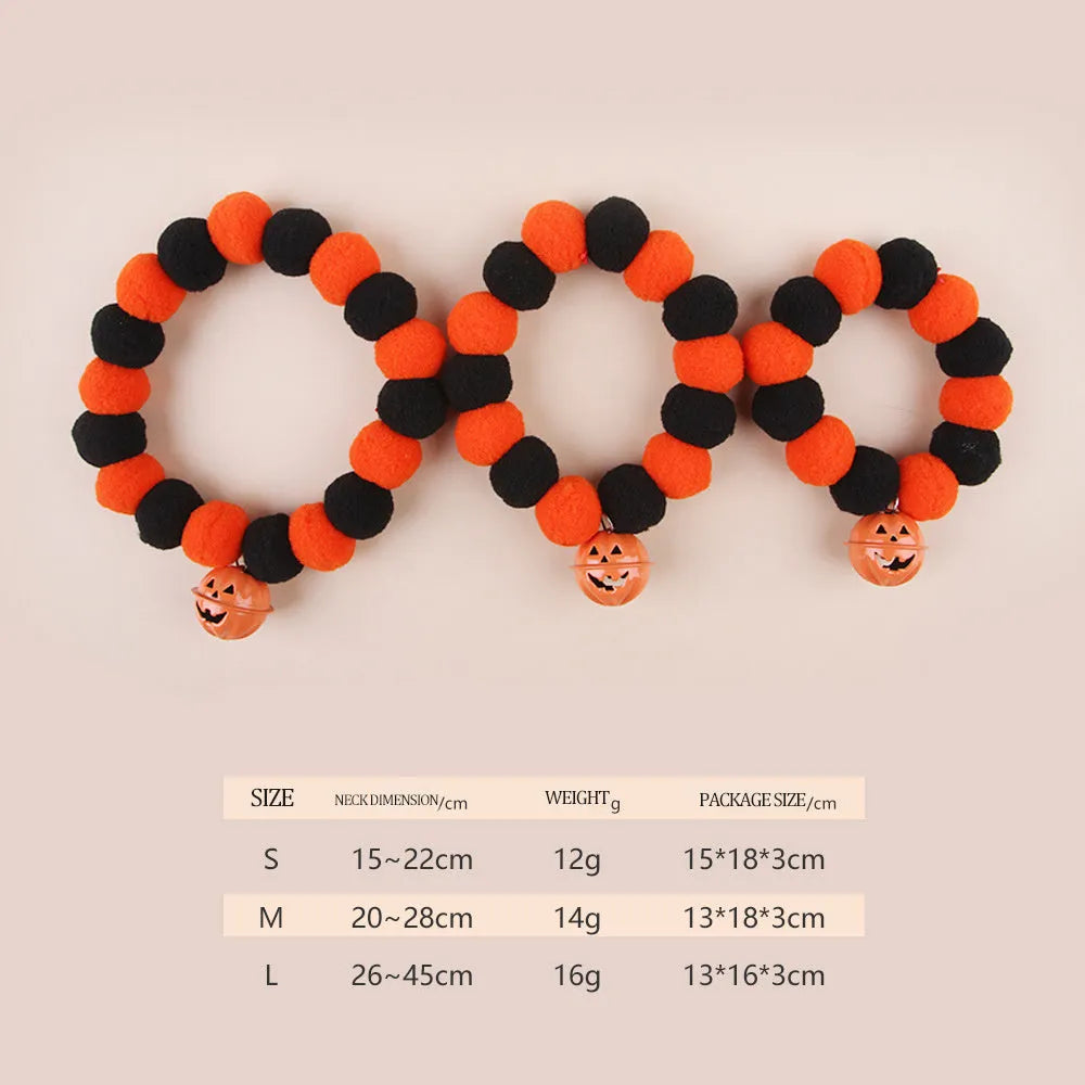 Orange Halloween cat collar with black pumpkin print and a silver bell, shown with an adjustable buckle.