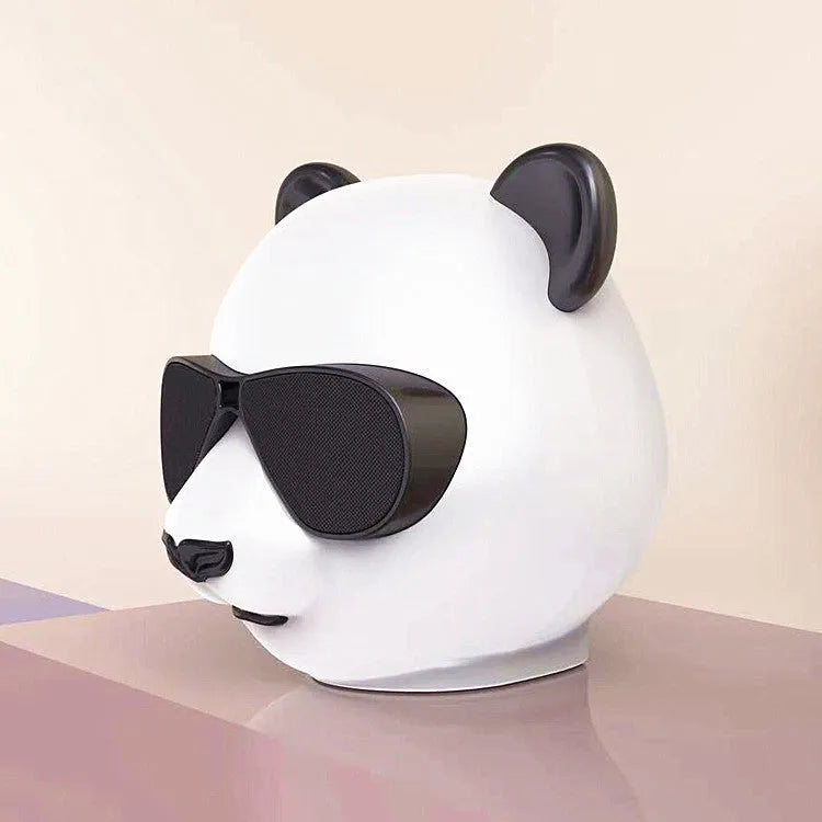 Portable mini classic style Bluetooth speaker showing USB charging port.