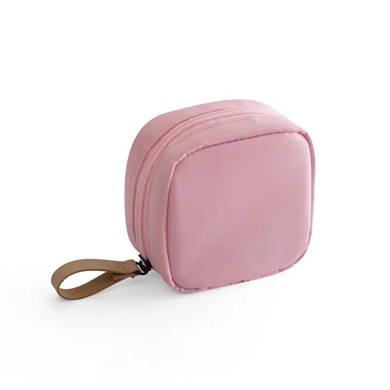Cube-shaped cloth makeup storage bag with zip closure in blue, pink, white colour options