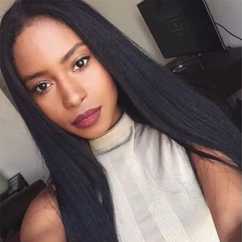 Long straight synthetic wig with centre-parted bangs in black colour on display