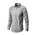 Man wearing a simple long-sleeve linen shirt in a loose fit, available in multiple colours and sizes.