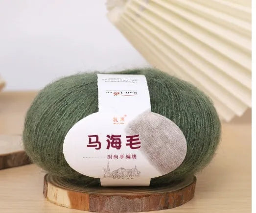 DIY mohair scarf weaving kit showing one wool ball and a selection of 34 colour options including white, pink, blue and green.