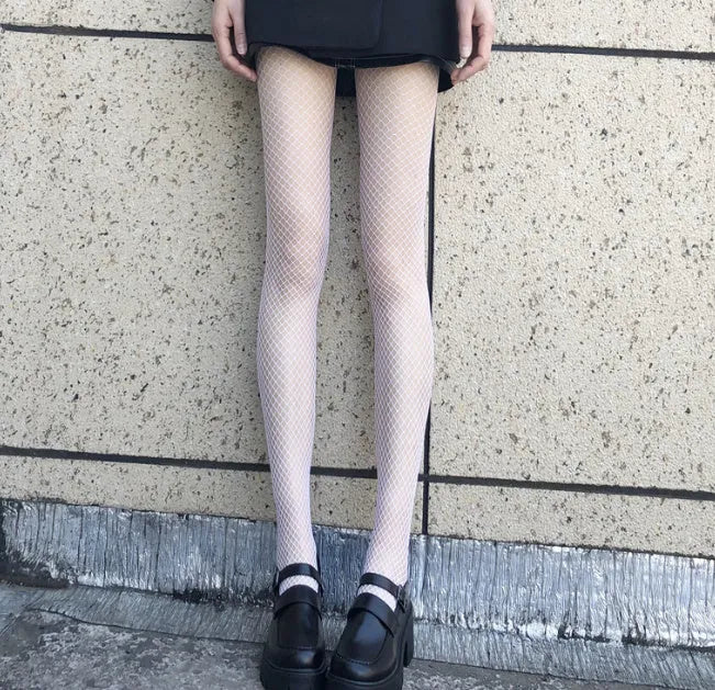 Women's mesh stockings showing large, medium, and small net patterns in black and white colours