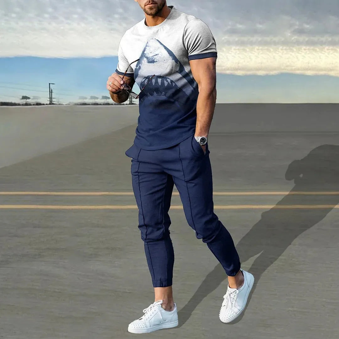 Man wearing a blue short-sleeved round neck pullover and matching trousers from a polyester sportswear set.